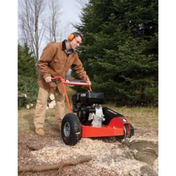 man with stump grinder